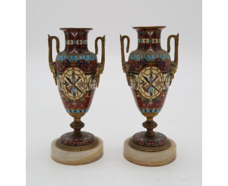 A PAIR OF BARBEDIENNE STYLE MINIATURE URNSwith champleve enamel and mask handles, 13cm high Condition report:Available upon r
