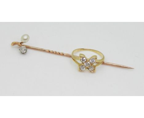 TWO EDWARDIAN JEWELS a bright yellow metal kiss shaped ring, inscribed faintly to the inner shank Mother 1910, set with estim