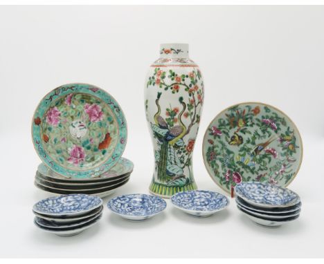 A CHINESE FAMILLE VERTE BALUSTER VASE Painted with peacocks, 29.5cm high, a wood stand, five Cantonese painted with red cappe