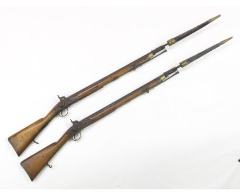 TWO VICTORIAN 1842 PATTERN PERCUSSION MUSKETS Each with lock-plate engraved "Tower 1844" under crowned VR cipher, the stocks 