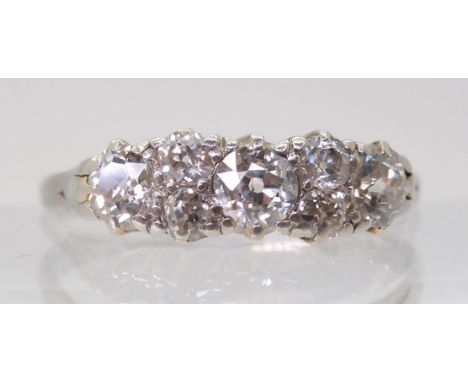 AN OLD CUT DIAMOND CLUSTER RING mounted throughout in white metal and set with estimated approx 0.50cts of old cut diamonds. 
