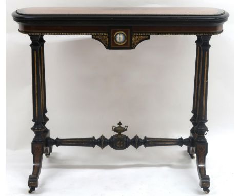 A VICTORIAN BURR WALNUT VENEERED EBONISED FOLDOVER CARD TABLE&nbsp; with shaped rectangular top concealing red baize playing 