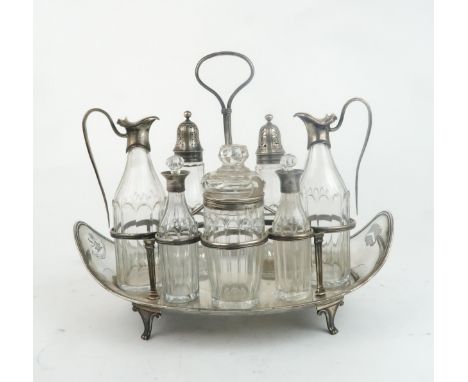 A GEORGE III SILVER CRUET STAND by Robert Hennell I, London 1792, of everted oval form, with seven circular cruet apertures, 