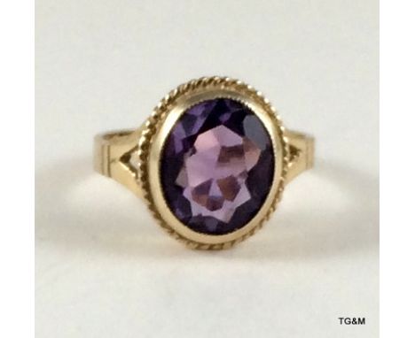 A 9ct gold ladies antique style amethyst ring size o