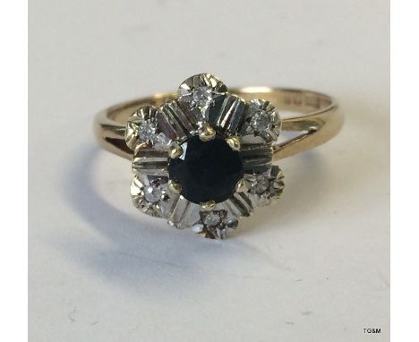 A ladies 9ct gold diamond sapphire cluster ring size n