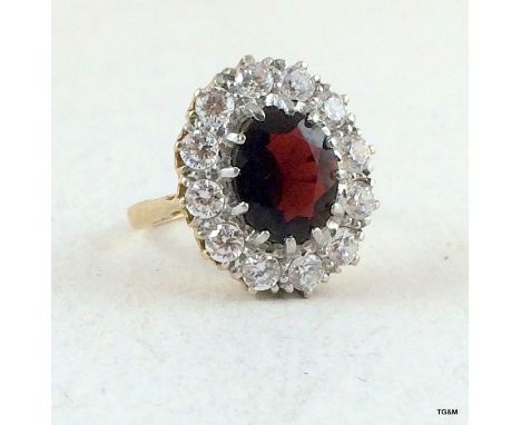 9ct gold ladies cluster ring garnet centre size O