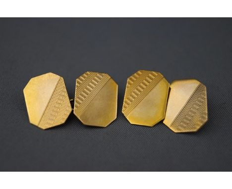 A pair of 9ct gold canted-rectangular and part engine turned twin-panel cufflinks with chain interlinks, Birmingham 1956, 3.5