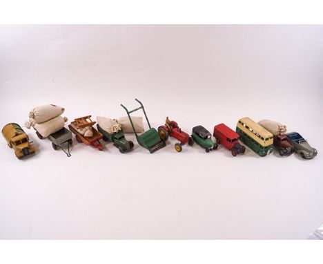A collection of Dinky die cast vehicles, including a Massey Harris tractor, Royal Mail van, Double Decker bus
