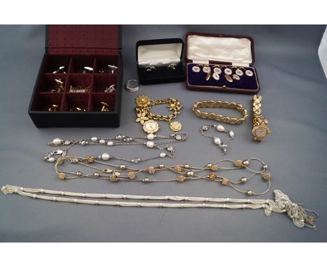 A collection of jewellery, including, a pair of early 20th century rose gold oval twin-panel cufflinks with chain inter-links