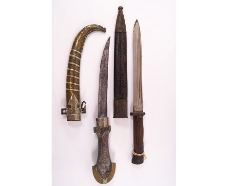 A German bayonet, the blade stamped Weyersberg Solingen, and a Middle Eastern dagger with wooden handle and brass sheath