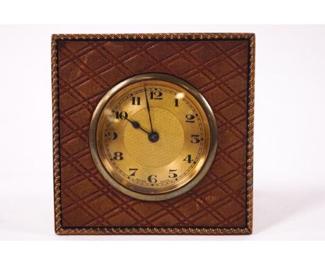A French gilt metal and leather strut bedside clock, 8cm square