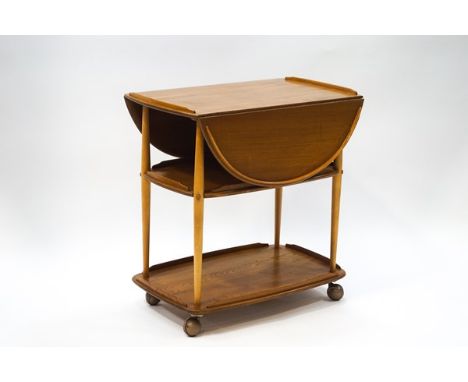 An Ercol style elm drop leaf two tier trolley, 76cm high x 73cm wide x 46cm deep