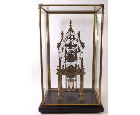 An unusual skeleton clock, eight day chain fusee movement, enamelled hour/minutes dial and separate seconds dial, with faux m