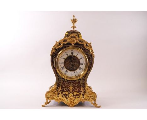 A French Tic-Tac-Toe mantel clock with visible escapement, the Boulle style ebonised case with gilt metal mounts, 37cm high 