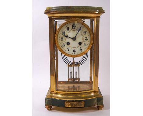 An early 20th century green marble and four glass sided mantel clock with eight day movement and double mercury pendulum and 