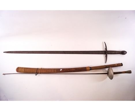 A Continental sword with scabbard, the blade 92cm long, a rapier and a tribal sword in wooden sheath