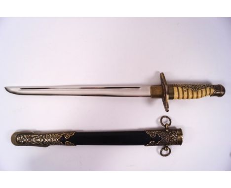 A European dress dagger and sheath with ornately decorated brass mounts and shagreen effect handle