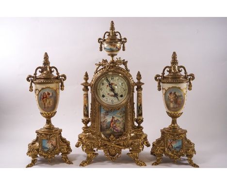 A French gilt metal mantel clock garniture, the eight day clock mounted with porcelain panels, the central one printed with a