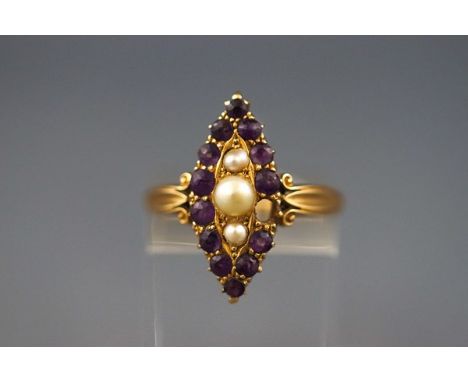 A yellow gold marquise shaped cluster ring set with graduated amethyst and seed pearls (One amethyst missing) stamped 18ct, s