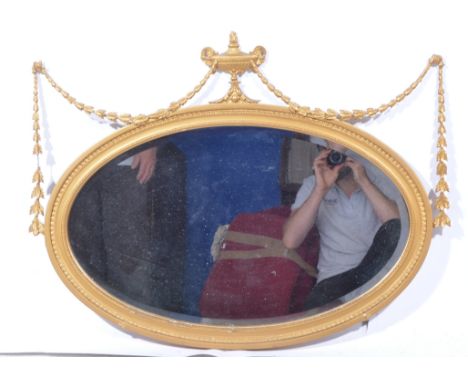 Edwardian wall mirror, Neo Classical style with an urn finial, bell flower swags, oval bevelled plate, width 90cm, height 67c