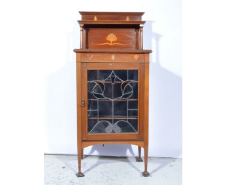 Edwardian inlaid mahogany music cabinet, Art Nouveau style marquetry decoration, back with a raised shelf, leaded glazed pane