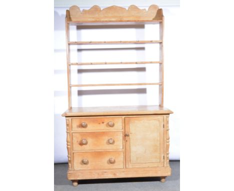 Victorian pine dresser, open three shelf rack, the base with a rectangular top, moulded edge, three drawers and a cupboard, t