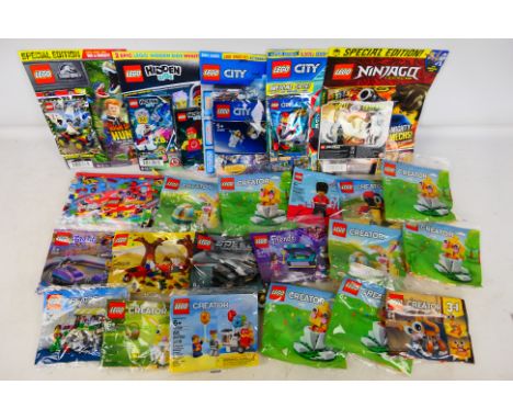 Lego - A group of approximately 22 polybagged and factory sealed Lego predominately 'Creator' sets including some Lego Comics