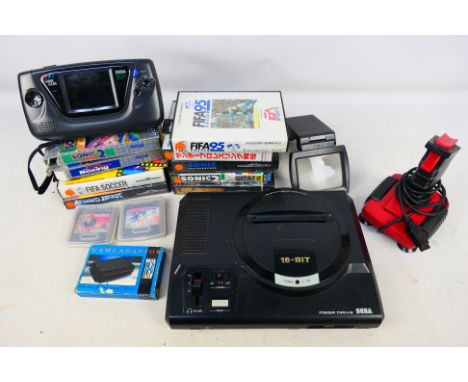Sega - A vintage Sega Mega Dive 16-Bit console with a Game Gear system, a joy stick, Game Gear Adaptor and games including So
