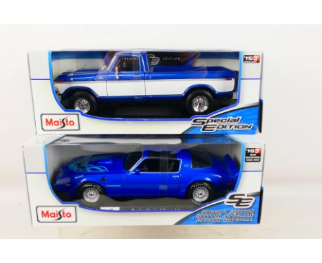 Maisto - 2 x boxed cars in 1:18 scale, Pontiac Firebird Trans Am in blue and 1979 Ford F150 Ranger Pick Up in blue and white.