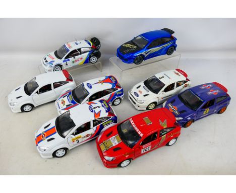 Solido - Bburago - Hot Wheels - 8 x unboxed Ford Focus models in 1:18 scale including WRC  versions. They have some minor mar