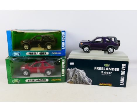 Ertl - 3 x boxed Land Rover Freelander models in 1:18 scale in purple # 7077, dark red # 7885 and black # 7897. They are a li