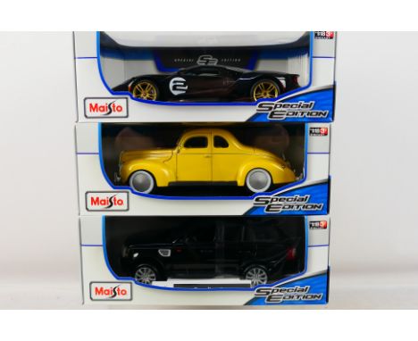 Maisto - 3 x boxed cars in 1:18 scale, 1939 Ford Deluxe Coupe, 2017 Ford GT and a Range Rover Sport. All appear Mint in Very 