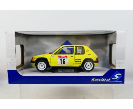 Solido - A boxed Peugeot 205 Rallye Tour De Corse 1990 car in 1:18 scale # 1801705. The car appears mint in a Good box with s