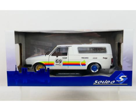 Solido - A boxed Volkswagen Caddy MkI in Apple Computer livery in 1:18 scale # S1803504. The car appears mint in a Good box w