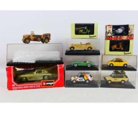 Bburago - New Ray - Minichamps - Ixo - A group of boxed models including Range Rover Camel Trophy, Rommel's Mercedes Staff Ca