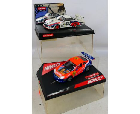 Carrera Evolution - Ninco - 2 x boxed Porsche slot cars, a 1978 935/78 'Moby Dick' # 27152 and a 911 GT3-R # 50259. The model