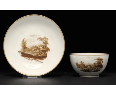 A PINXTON TEA BOWL AND SAUCER, 1796-1813 painted with landscapes, saucer 13.5cm diam ++Slight scratches to the landscape pain