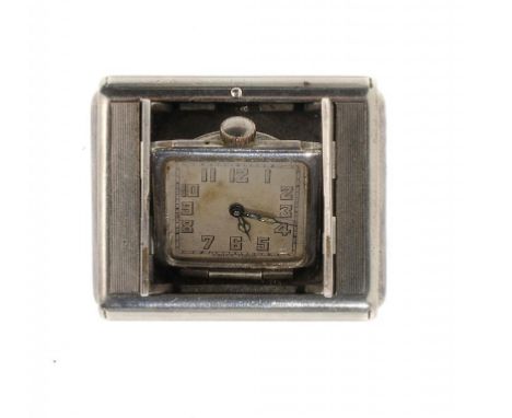 A TAVANNES SILVER TRAVELLING WATCH, C1930 ref 5122, in engine turned case, c1930, 33 x 45mm ++Lacks screws causing movement t