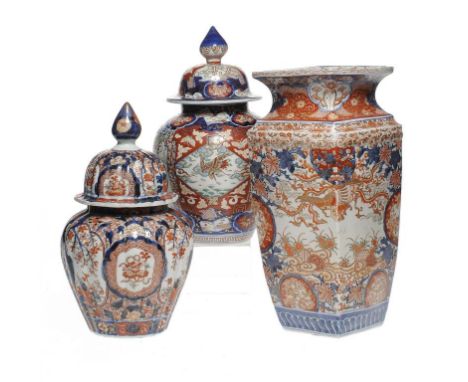 TWO JAPANESE IMARI JARS AND COVERS AND A JAPANESE IMARI VASE OF SQUARE SECTION, MEIJI square vase 32.5cm h ++The lot in good 