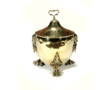 A BRASS VASE SHAPED COAL BOX AND COVER, EARLY 20TH C with cast grotesque mask handles and paw feet, 50cm h ++In good conditio