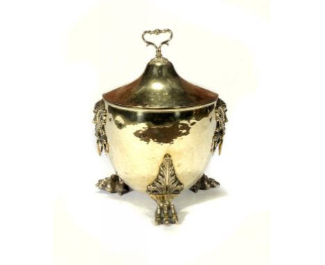 A BRASS VASE SHAPED COAL BOX AND COVER, EARLY 20TH C with cast grotesque mask handles and paw feet, 50cm h ++In good conditio