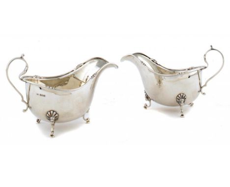 A PAIR OF GEORGE V SILVER SAUCE BOATS 10cm h, by Walker & Hall Ltd, Sheffield 1930, 10ozs ++Light polish scratches and polish