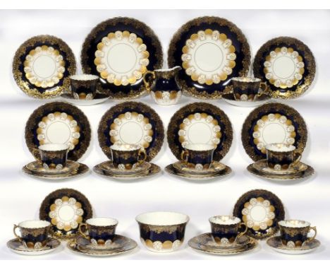 AN AYNSLEY COBALT GROUND TEA SERVICE, C1930 the pair of plates 23cm diam, printed mark (39) ++Crack in base of sugar basin