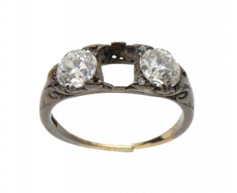 A DIAMOND TWO STONE RING, C1920 in gold, size M ++Originally a three stone ring lacking the centre stone, the shank very worn