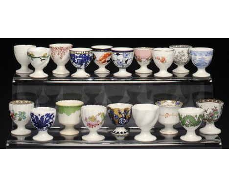 NINETEEN COALPORT EGG CUPS, 1876-1926 various patterns and sizes, printed marks ++One or two cracked; some light wear No Rese