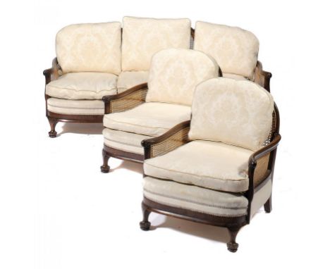 A WALNUT AND CANED BERGÈRE SUITE, C1930 sofa 93cm h, 183cm w (3) ++Originally double caned, recaned in recent years for the p