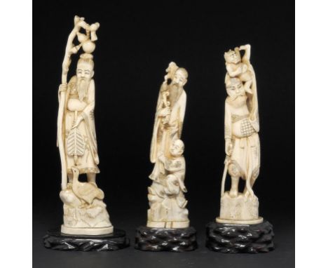 THREE JAPANESE IVORY FIGURES OF SHOKI THE DEMON QUELLER, AND AN ONI, GAMA SENNIN AND LI TIEGUI, MEIJI 22-28.5cm h, two signed