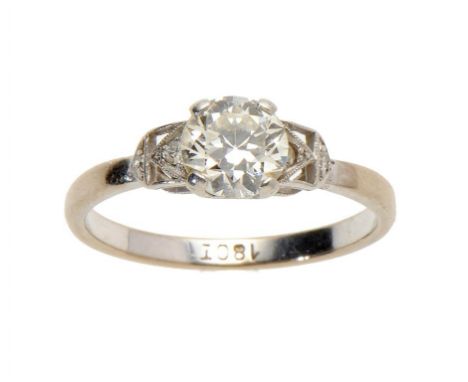 A DIAMOND RING, MID 20TH C the round brilliant cut diamond flanked by diamond shoulders, in white gold, marked 18ct, size N +