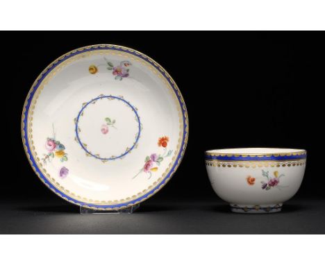 A DERBY BLUE AND GILT BORDERED TEA BOWL AND SAUCER, C1777-84 saucer 13cm diam, crown over D in blue ++Light wear mainly confi