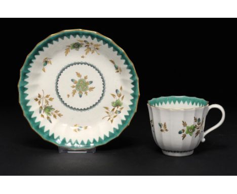 A WORCESTER FLUTED COFFEE CUP AND SAUCER, C1770 with green enamel and gilt flower sprigs in French Green border, saucer 13.5c